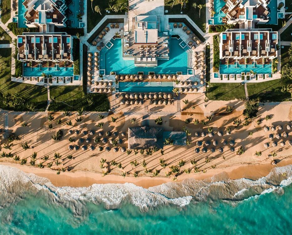 Excellence El Carmen adults-only all-inclusive resort with modern suites and beachfront pools in Punta Cana.