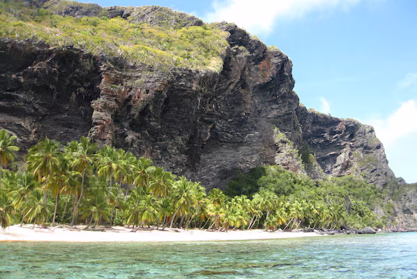 Fronton Beach near Secrets Playa Esmeralda Resort & Spa with dramatic cliffs and crystal-clear turquoise waters