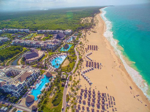 Hard Rock Hotel and Casino Punta Cana all-inclusive resort with large pools, beachfront, and entertainment complex.