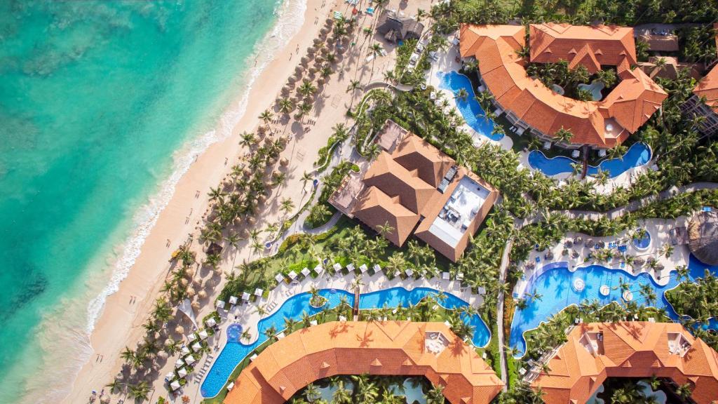 Majestic Elegance Punta Cana all-inclusive resort with beachfront pools and tropical landscaping.