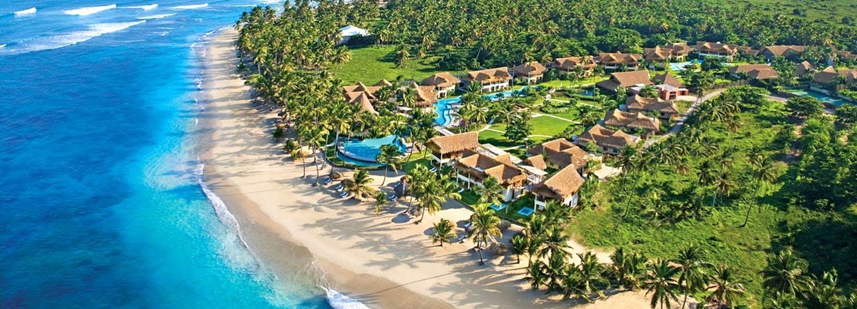 Zoëtry Agua Punta Cana boutique all-inclusive resort with thatched-roof suites and beachfront wellness atmosphere.